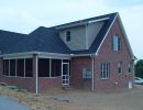 long rear screened porch shed dormer brick