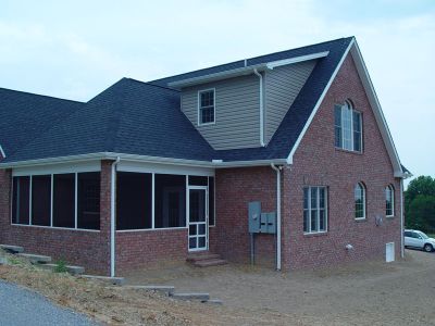 long rear screened porch shed dormer brick
