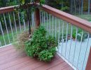 over composite decking and metal rail