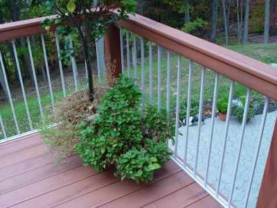 over composite decking and metal rail