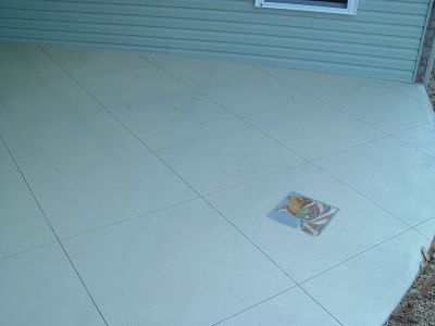 pif scored stained concrete with tile inset